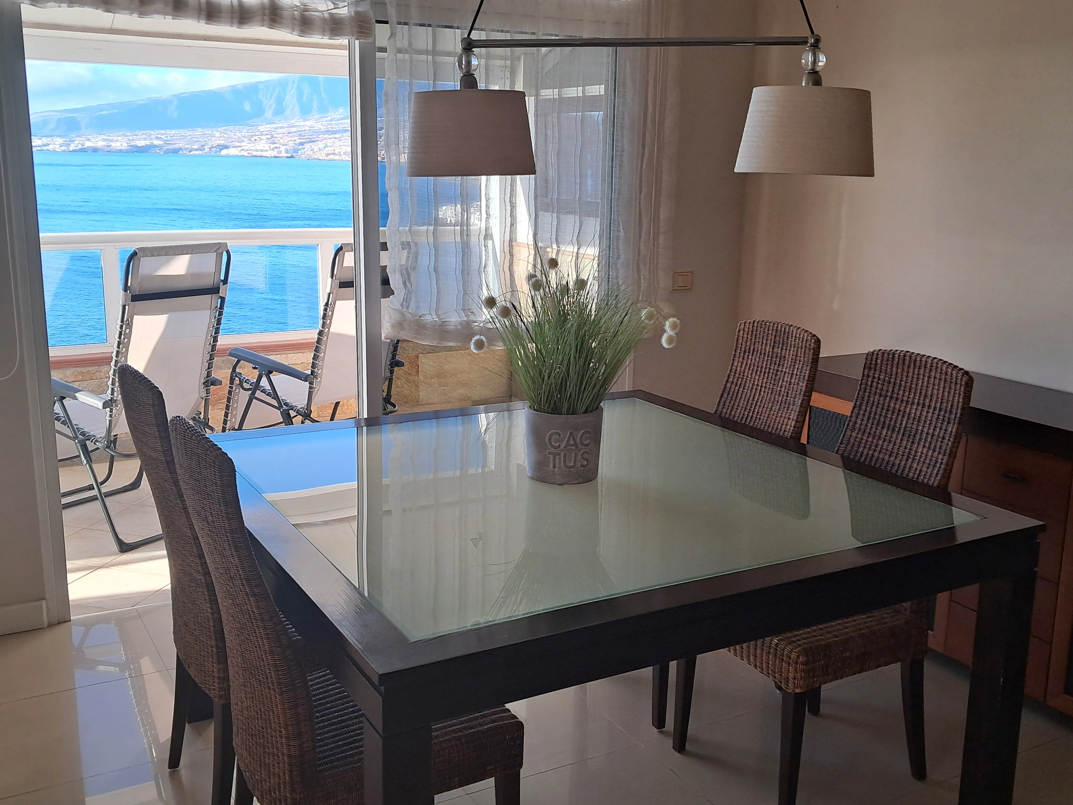 Open-plan kitchen with central island and dining area