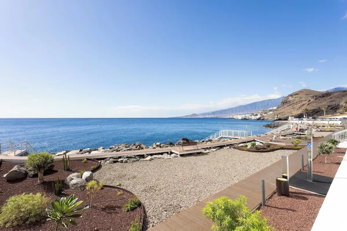 Pebble shore and coastline seen from the Tabaiba promenade