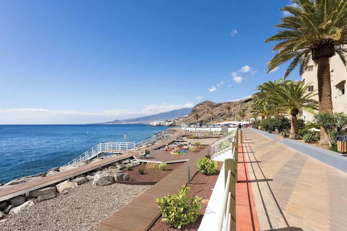 Palm-lined seafront promenade running along the Tabaiba coast